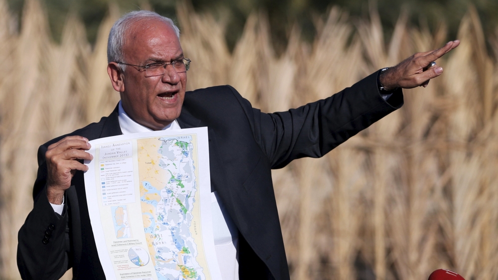 Palestinian Chief negotiator Saeb Erekat holds a map as he speaks to media about the Israeli plan to appropriate land, in Jordan Valley near the West Bank city of Jericho