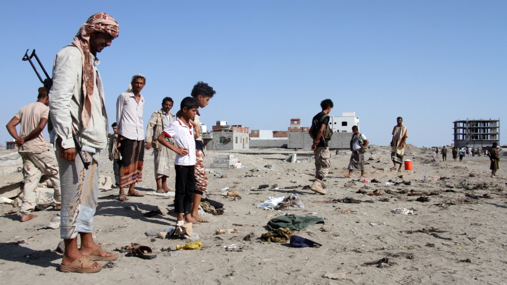 Yemenis gather at al-Sawlaba base in Aden''s al-Arish district after a suicide bomber targeted a crowd of soldiers.