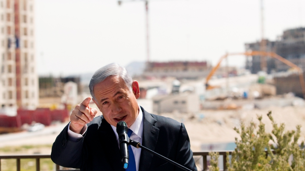 FILE PHOTO: Israeli Prime Minister Benjamin Netanyahu delivers a statement in front of new construction, in the Jewish settlement known to Israelis as Har Homa and to Palestinians as Jabal Abu Ghneim