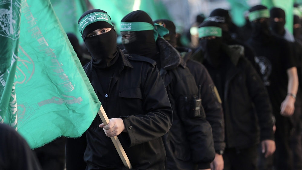 Masked fighters march to mark Hamas' 29th anniversary in Gaza [EPA]