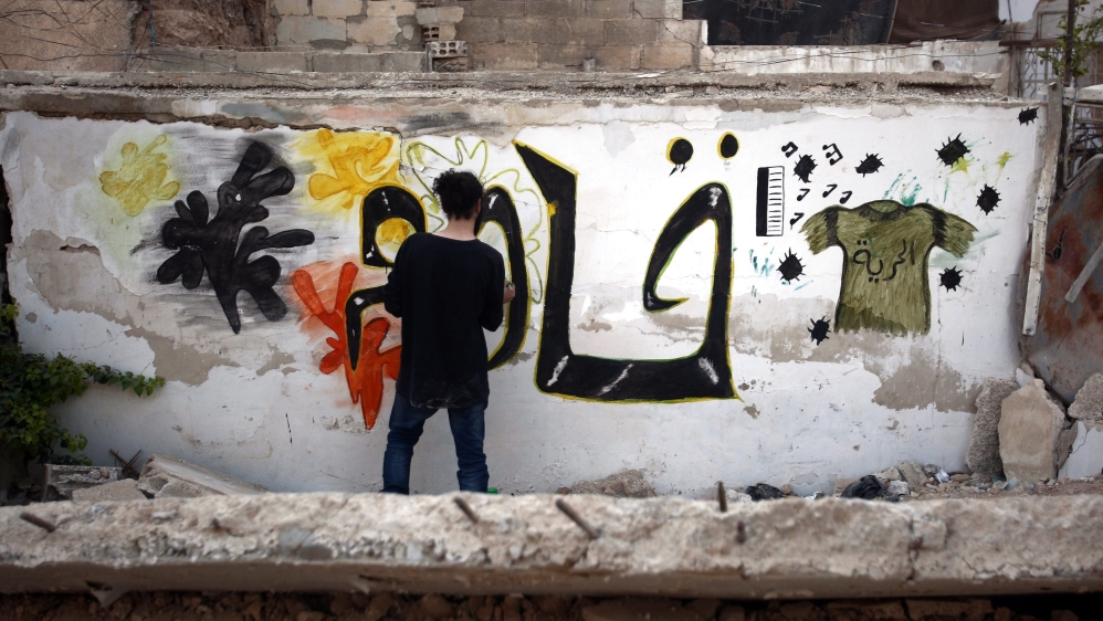 Syrian graffiti artist in rebel-held nieberhood of al-Qaboon