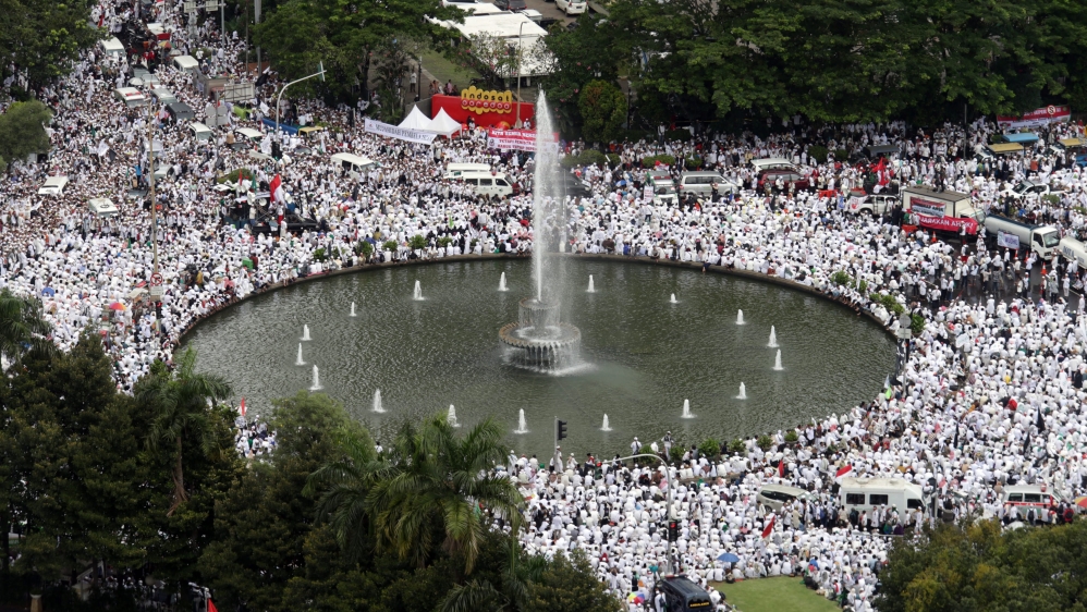  Police officials estimated that at least 150,000 people had gathered under drizzling rain [Reuters]