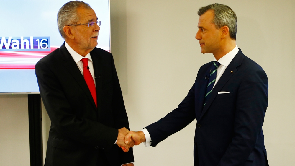 In May, Van der Bellen (left) defeated Hofer by a margin of 0.6 percent during their presidential runoff [Reuters]