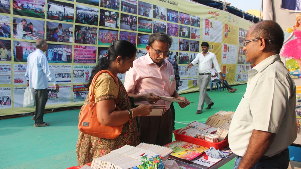Buyers browse used book stalls at the Vijayawada Book Festival [Swati Sanyal Tarafdar/Al Jazeera]