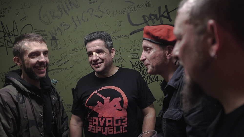 Chloros, centre, says his band regularly performs at anti-racist festivals [Nick Paleologos/SOOC/Al Jazeera]