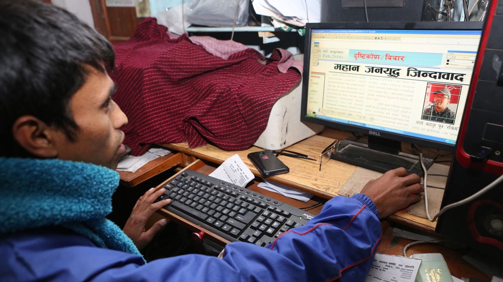 Biswokarma edits the opinion page of Rolpa Samachar [Prabhat Jha/Al Jazeera]