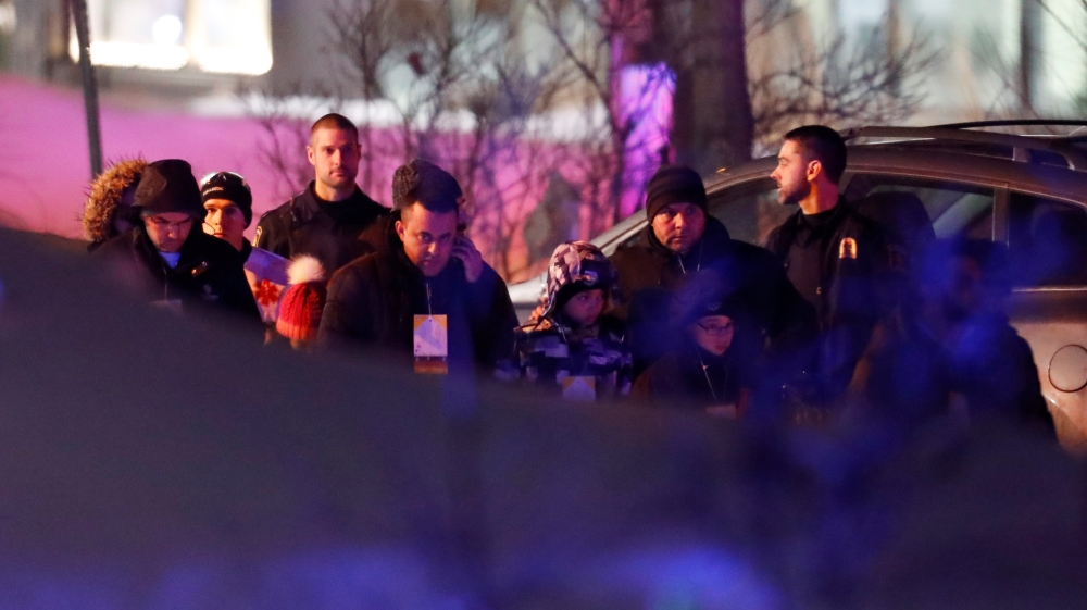 People leave a mosque after a shooting in Quebec City