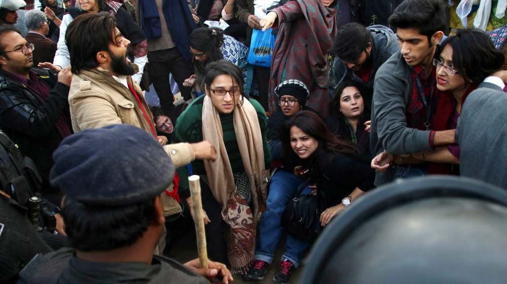 Police clash with protesters demanding investigations into the disappearances of civil activists Salman Hiader, Waqas Goraya and Asim Saeed [Shahzaib Akber/EPA]