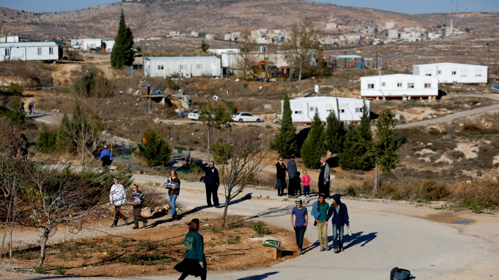 FILE PHOTO: Israelis prepare for an expected eviction of the Jewish settlement outpost of Amona in the occupied West Bank