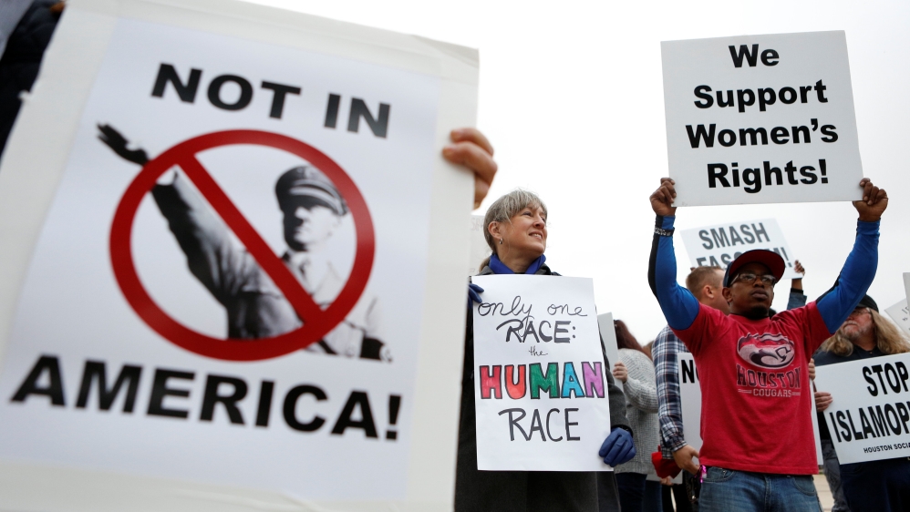 People protest on the day white nationalist leader Richard Spencer of the National Policy Institute is due to speak on campus at an event not sanctioned by the school, at Texas A&M Uni