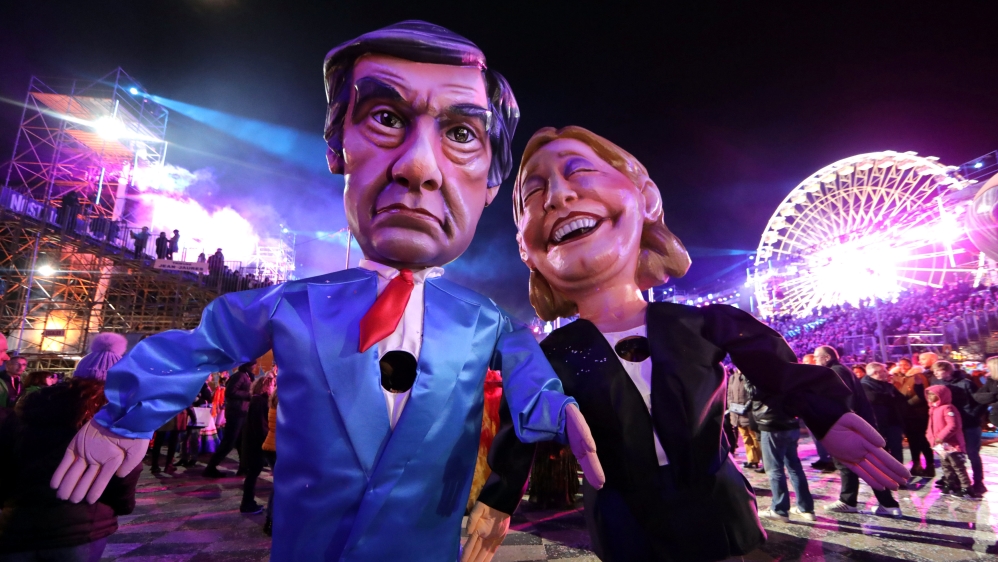 Figures of Francois Fillon and Marine Le Pen are paraded through the crowd during the 133rd Carnival parade, the first major event since the city was attacked during Bastille Day