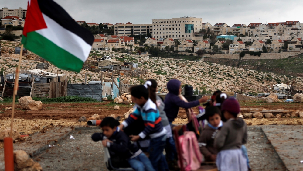 Palestinian bedouin children from the Abu Nawar community attend a class in the West Bank town of al-Azariya near the Jewish settlement of Maale Adumim