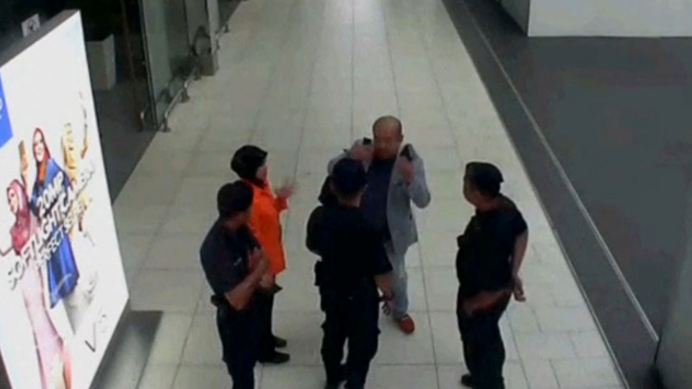 Video grab appears to show a man purported to be Kim Jong Nam talking to security personnel, after being accosted by a woman in a white shirt, at Kuala Lumpur International Airport in Malaysia