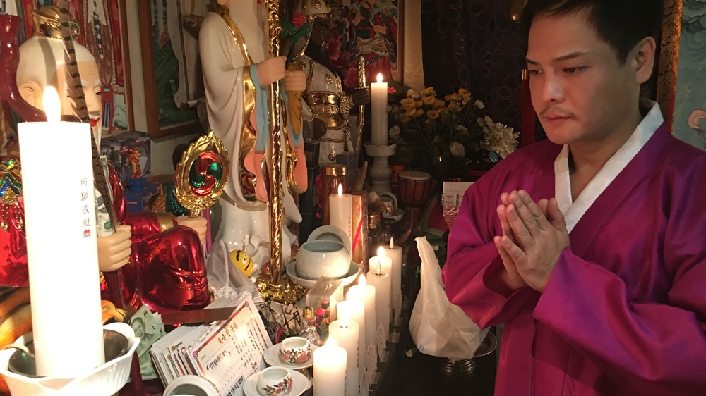 Shamans in South Korea step in as 'psychotherapists', dealing with a range of issues from family problems to helping a young woman find love [Jason Strother/Al Jazeera]