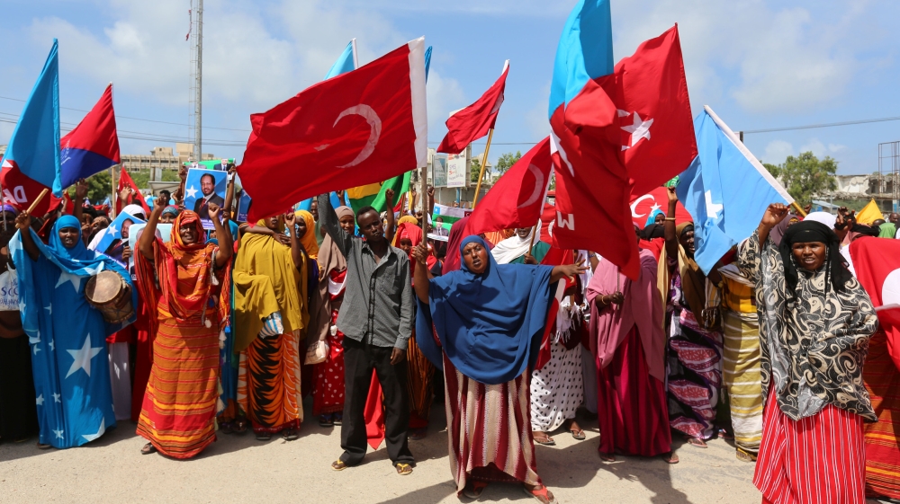 Somali people carry Turkish and Somali flags as they gather in support of Turkish President Tayyip Erdogan and his government in Somalia''s capital Mogadishu