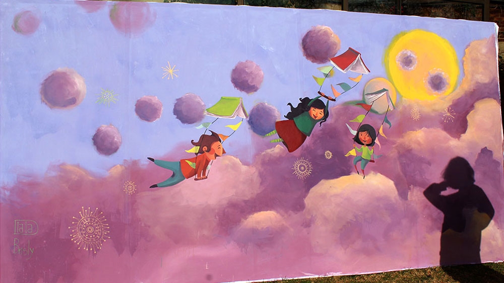 'Through painting, we can help children imagine their own world and live it,' says Brisely [Courtesy of Diala Brisly/Al Jazeera]