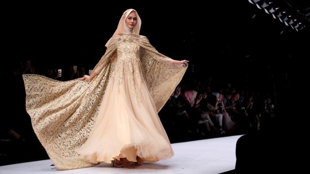 A model presents a Muslim wear by Indonesian designer Qonita Gholib during the Jakarta Fashion Week in Jakarta