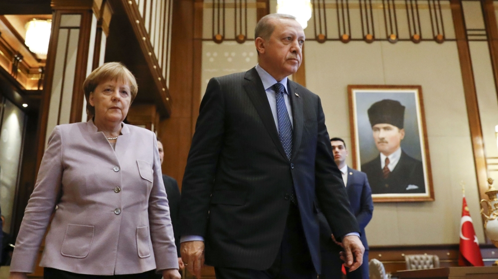 Turkish President Erdogan and German Chancellor Merkel arrive for a bilateral meeting in Ankara