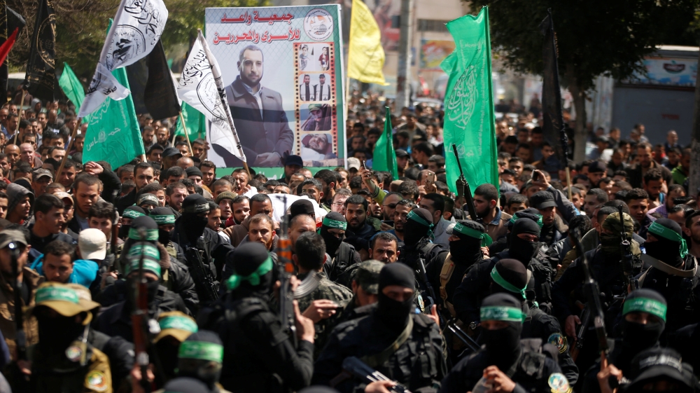 Palestinian members of Hamas'' armed wing take part in the funeral of senior militant Mazen Fuqaha