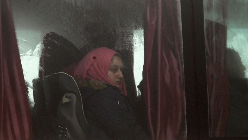 People evacuated from the two villages of Kefraya and al-Foua, after an agreement reached between rebels and Syria''s army, ride a bus at insurgent-held al-Rashideen, Aleppo province