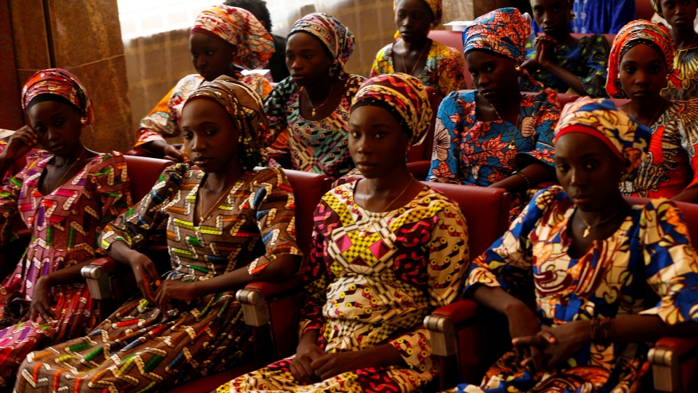 Some of the 21 Chibok schoolgirls released by Boko Haram look on during their visit to meet President Muhammadu Buhari In Abuja, Nigeria
