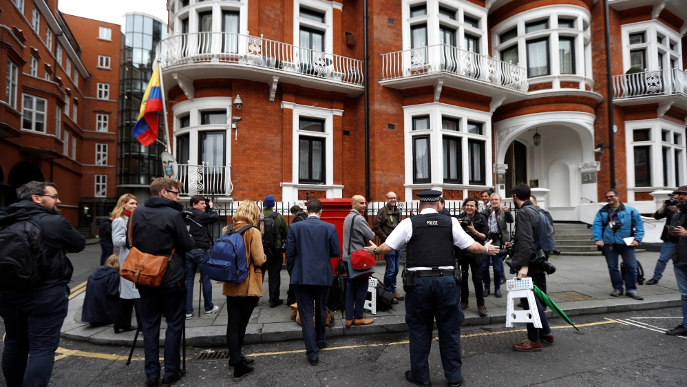 Journalists are seen outside the Ecuadorian embassy in London where WikiLeaks founder Julian Assange is taking refuge