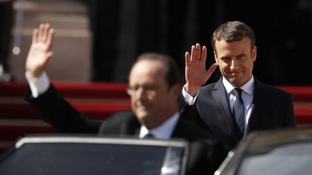 Macron met with predecessor Hollande before the ceremony to discuss the most sensitive issues facing France, including the country's nuclear codes [Yoan Valat/AP]