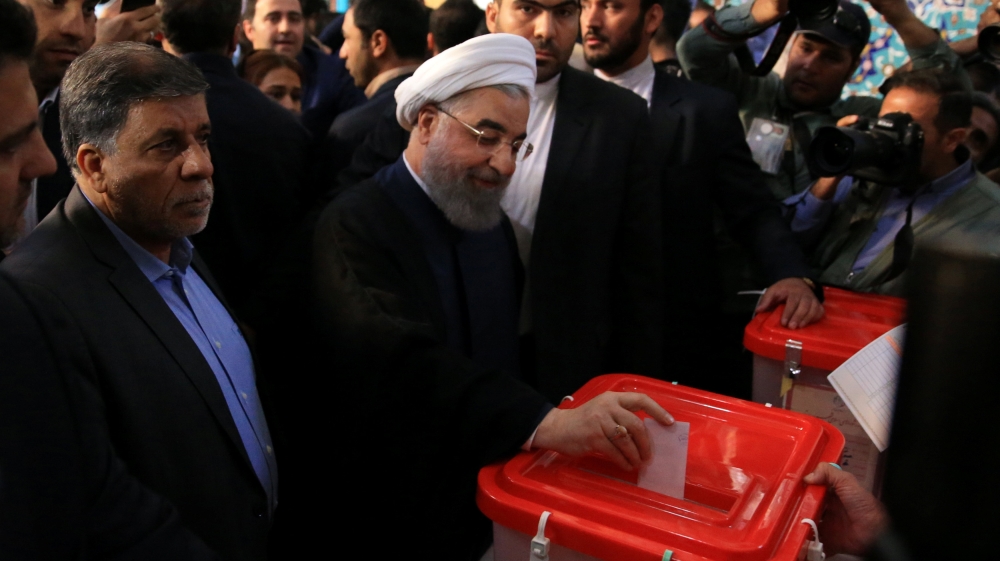 The election is seen as a verdict on Rouhani's policies towards the economy and the world [Tima/Reuters]