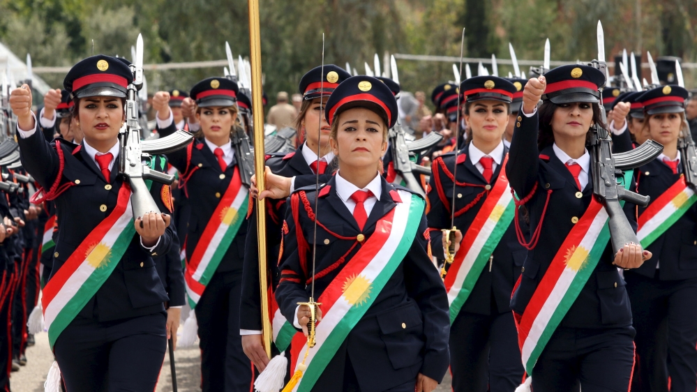 Female Kurdish Peshmerga march during their graduation ceremony at a police academy in Zakho