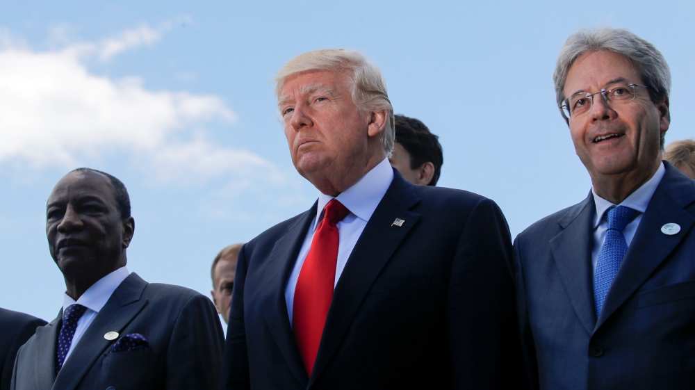 Trump stands next to Italian PM Gentiloni and Guinea''s President Conde during family photo at the G7 Summit expanded session in Taormina