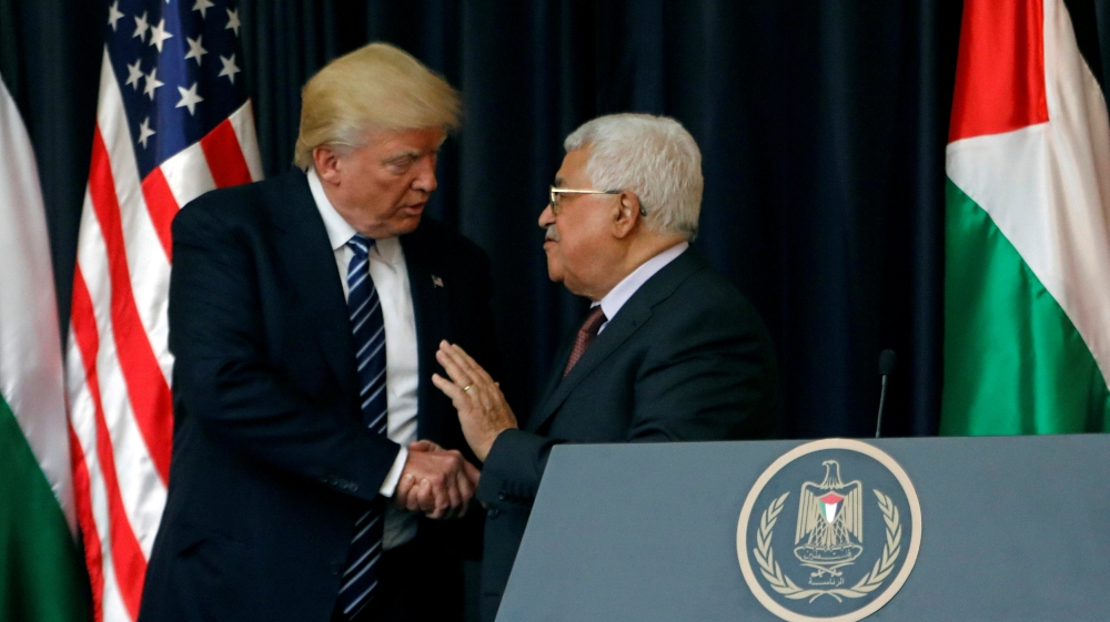 U.S. President Donald Trump shakes hands with Palestinian President Mahmoud Abbas during a joint news conference at the presidential headquarters in the West Bank town of Bethlehem