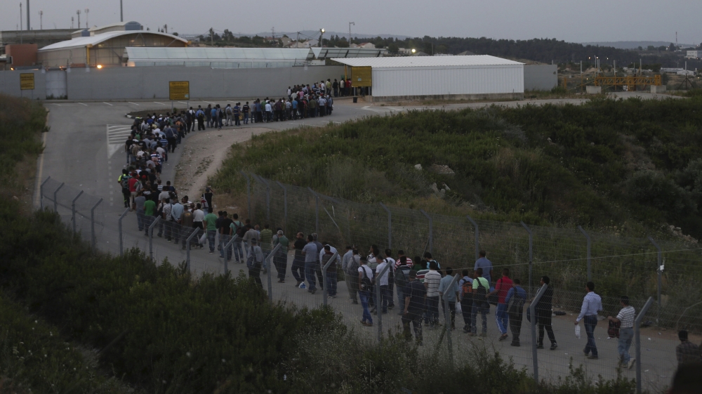  There are hundreds of checkpoints, roadblocks and flying checkpoints in the West Bank, and between Israel and the West Bank where Palestinians must show proof of identification and be searched [Reuters]