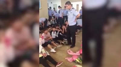 
Amateur footage shows detained protesters in Wukan on September 13, 2016 [Screengrab/Al Jazeera]
