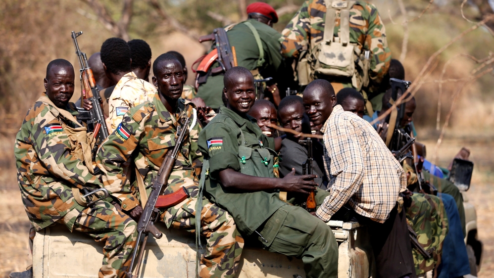 FILE PHOTO - South Sudan''s rebels with weapons travel in a truck in a rebel-controlled territory in Jonglei State