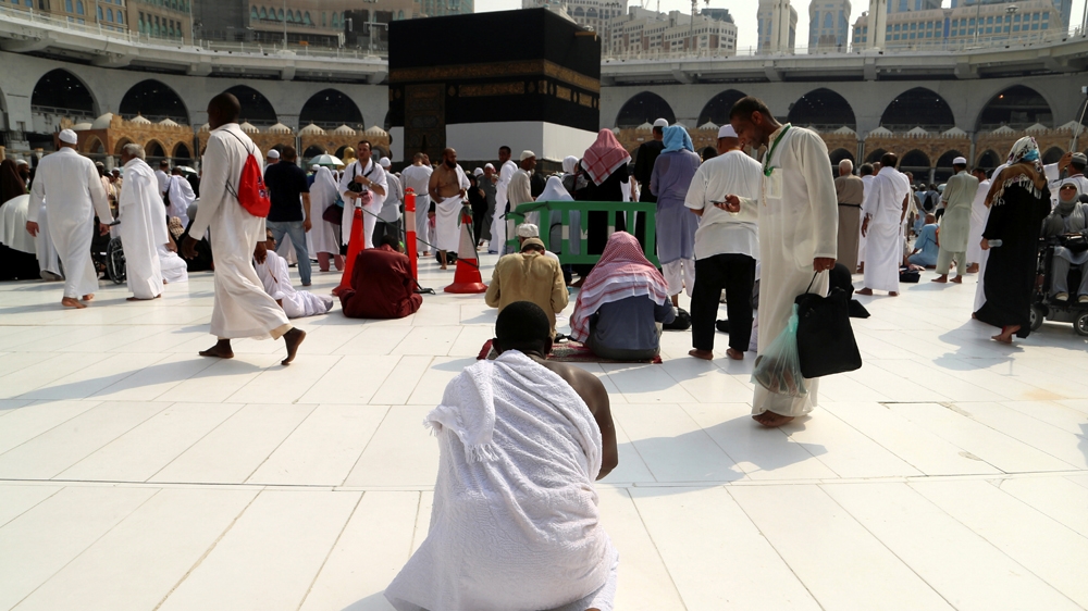 A Muslim pilgrim prays near the Kaaba at the Grand mosque in Mecca