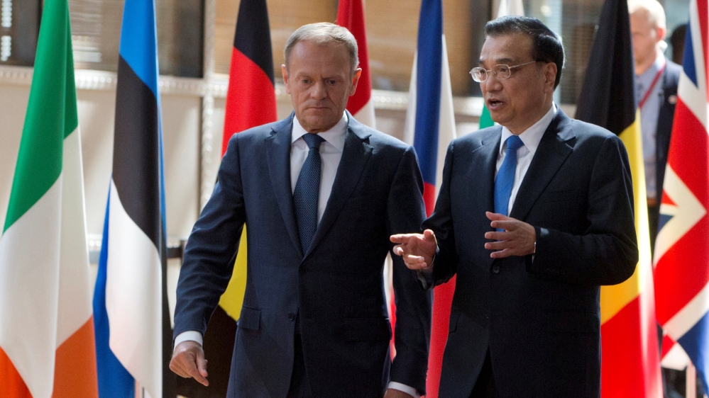 EU Council President Tusk and Chinese Premier Li Keqiang arrive to attend a EU-China Summit in Brussels