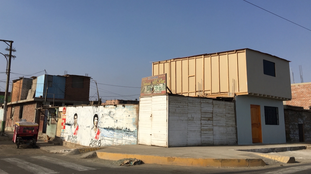 A wooden house in La Perla Baja [Paula Dupraz-Dobias/Al Jazeera]