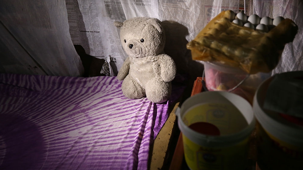  A teddy bear sits on a bed where feverish baby Benson was taken to an Ebola treatment centre in October 2014 [John Moore/Getty Images] 