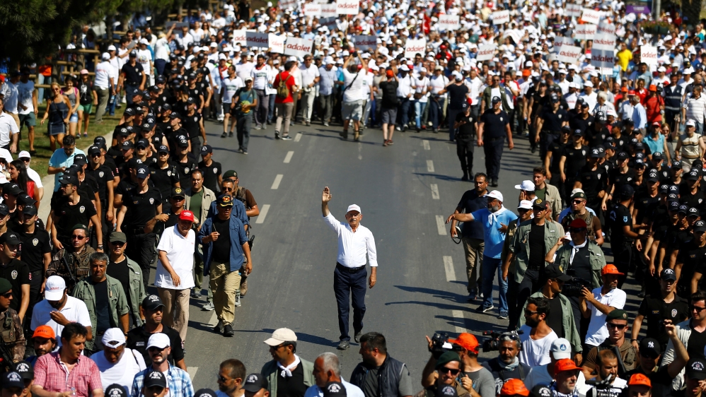Turkey''s main opposition leader Kilicdaroglu walks flanked by his supporters during the 24th day of a protest, dubbed "justice march", in Istanbul