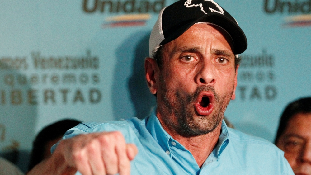Capriles blamed what he termed President Maduro's 'sick ambition' [Christian Veron/Reuters]