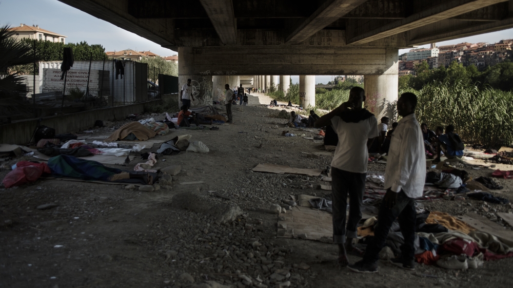 Sudanese Zaghawa refugees sleep along the Roya River [Maurizio Martorana/Al Jazeera]