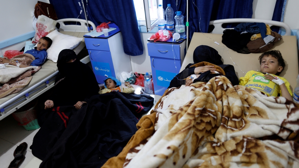 Women accompany cholera-infected children at a hospital in Sanaa