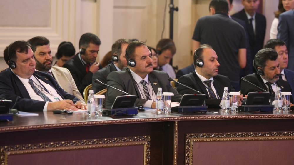 Members of the Syrian opposition delegation attend the round on Syria peace talks in Astana