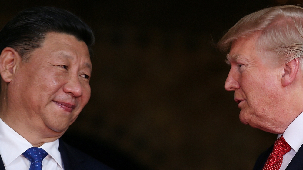FILE PHOTO: U.S. President Donald Trump welcomes Chinese President Xi Jinping at Mar-a-Lago state in Palm Beach, Florida, U.S.