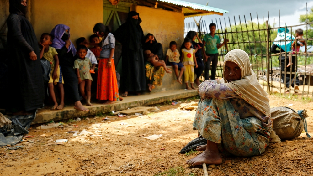 New Rohingya refugees sit near the Kutupalang makeshift refugee camp, in Cox''s Bazar