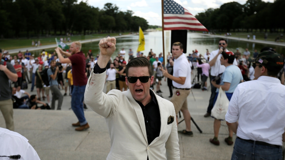 White nationalist leader Richard Spencer chants back at counterprotestors as self-proclaimed 'white nationalists' and 'alt-right' supporters gather for what they called a