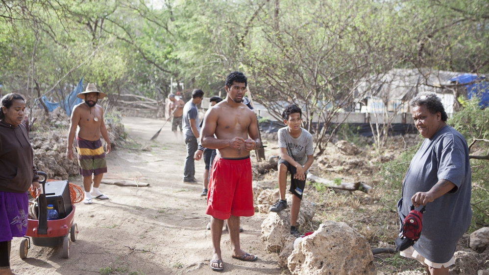 Twinkle Borge, the leader of Pu'uhonua camp, organises the community work. Every resident in the community must volunteer eight hours a week for the upkeep of the settlement [Emre Caylak/Al Jazeera]
