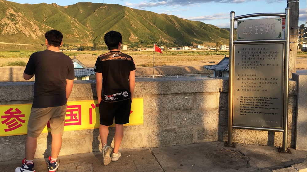 Tourists in China look across to the North Korea border from Tumen [File: Reuters]