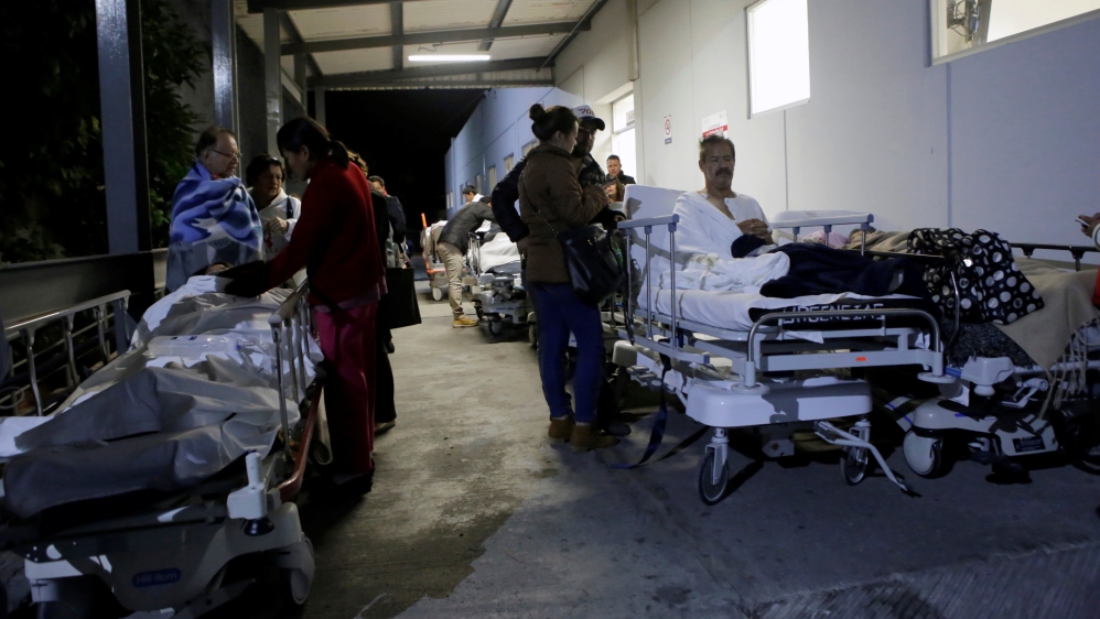 Patients and family members stand outside the Institute for Social Security and Services for State Workers (ISSSTE) after the earthquake [Reuters]