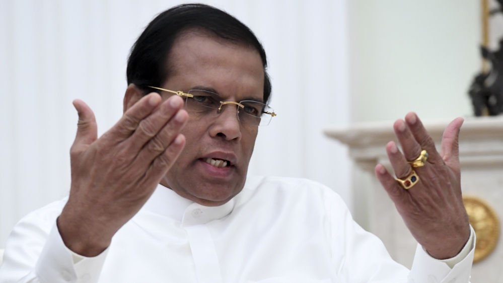 Sri Lankan President Sirisena gestures as he speaks during meeting with his Russian counterpart Putin at Kremlin in Moscow
